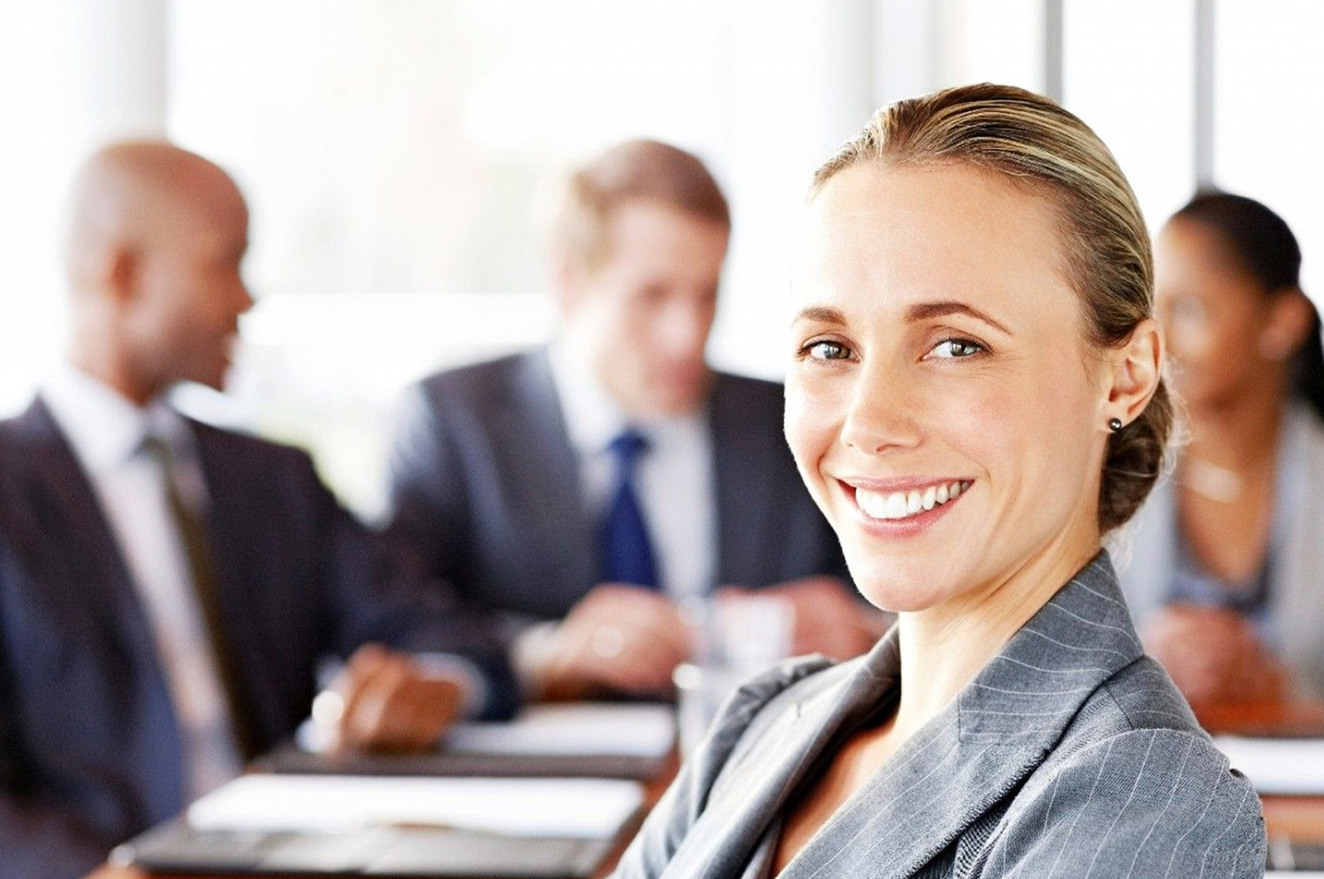 Portrait of business woman with group of people